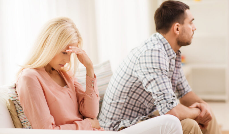 An unhappy woman and man engaging in conflict