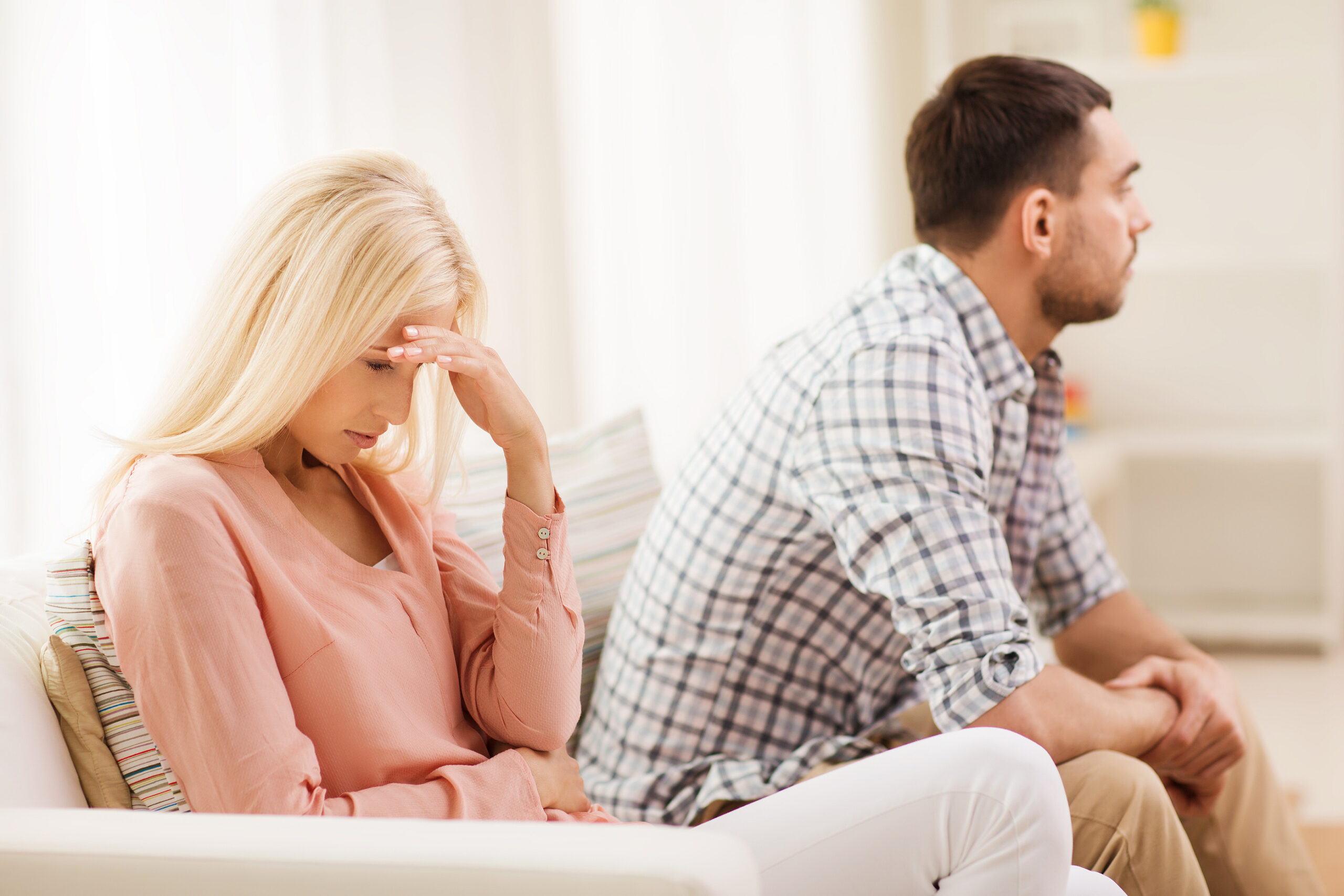 An unhappy woman and man engaging in conflict